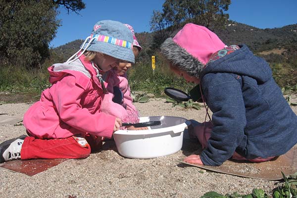 Students playing with magnifiers