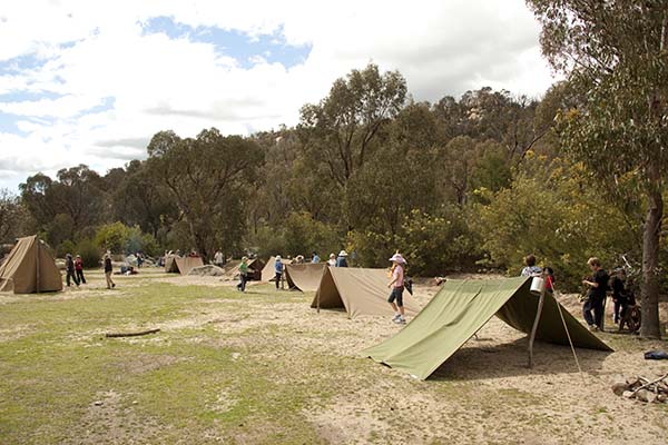 Students viewing old mining camp grounds
